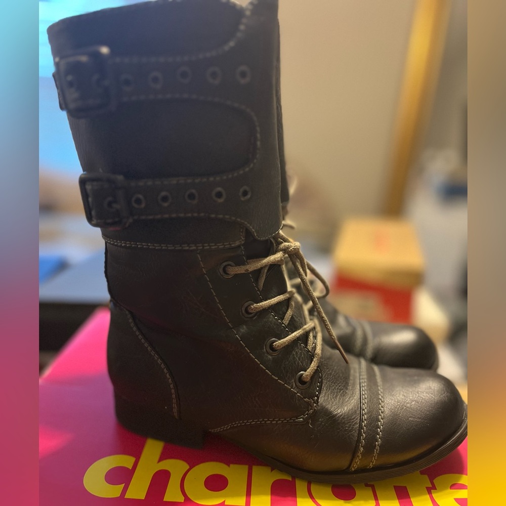 Gray lace up combat boot with double buckle ankle detail